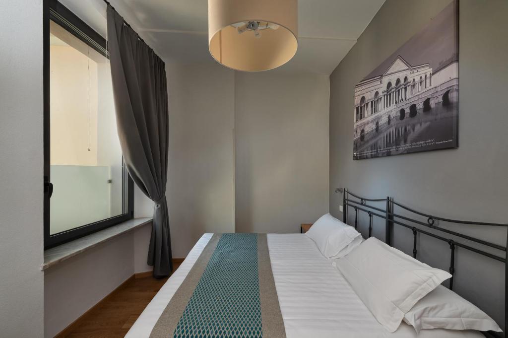 Postel nebo postele na pokoji v ubytování Hotel dei Gonzaga