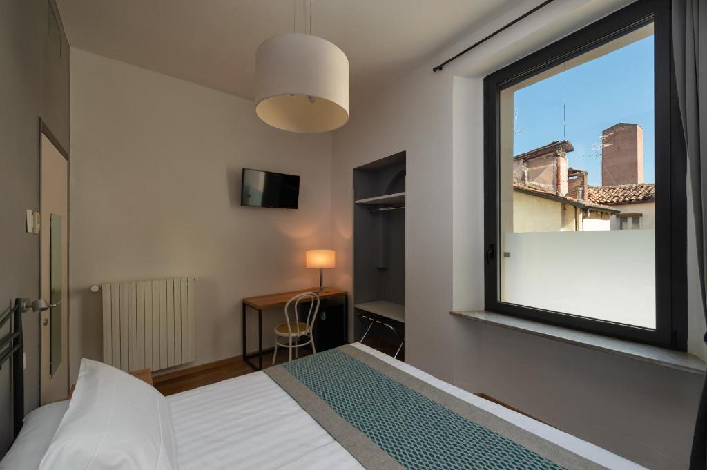 Postel nebo postele na pokoji v ubytování Hotel dei Gonzaga