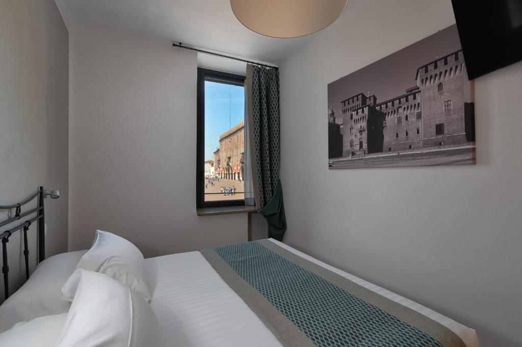 Postel nebo postele na pokoji v ubytování Hotel dei Gonzaga