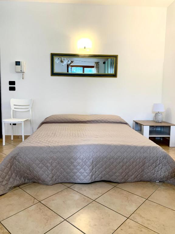 A bed or beds in a room at Casa Alice