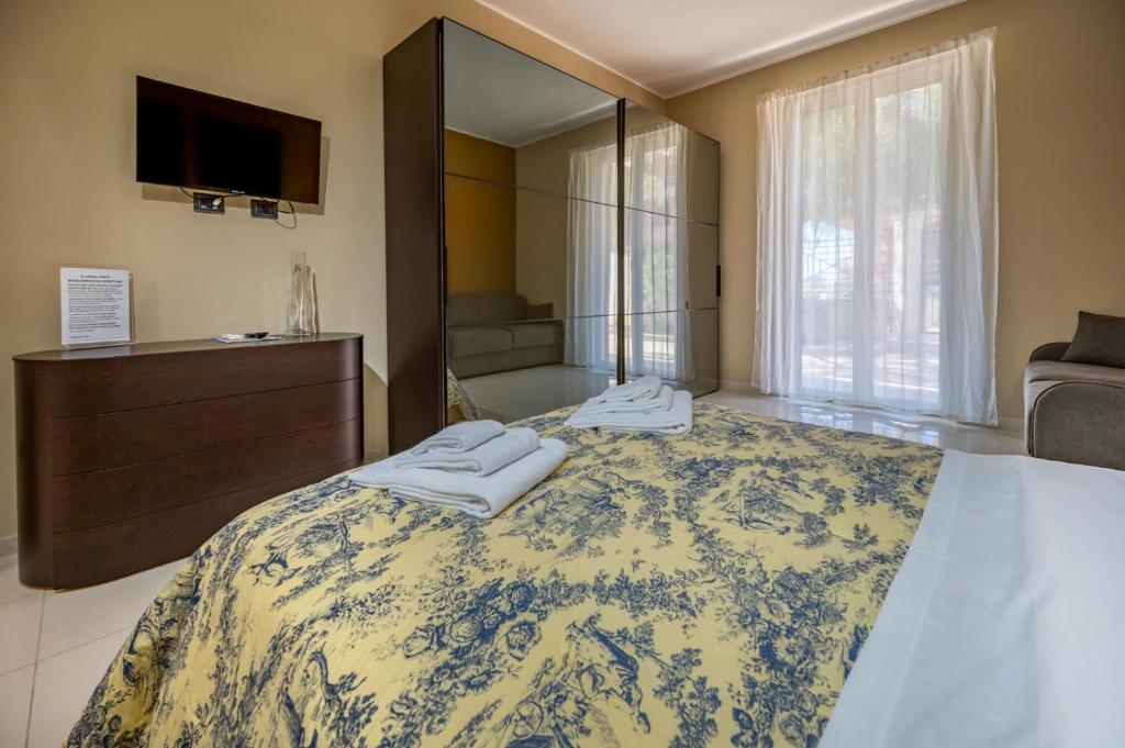 Posteľ alebo postele v izbe v ubytovaní Villa Floyd Charming Rooms B&B