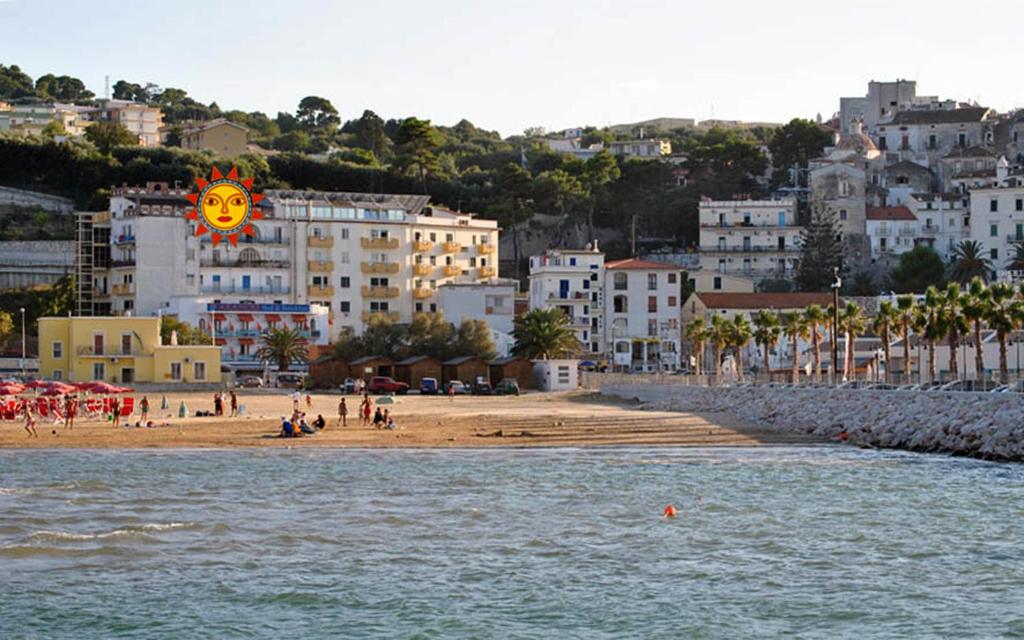 a view of a beach with people on the beach at Hotel Solaria in Rodi Garganico