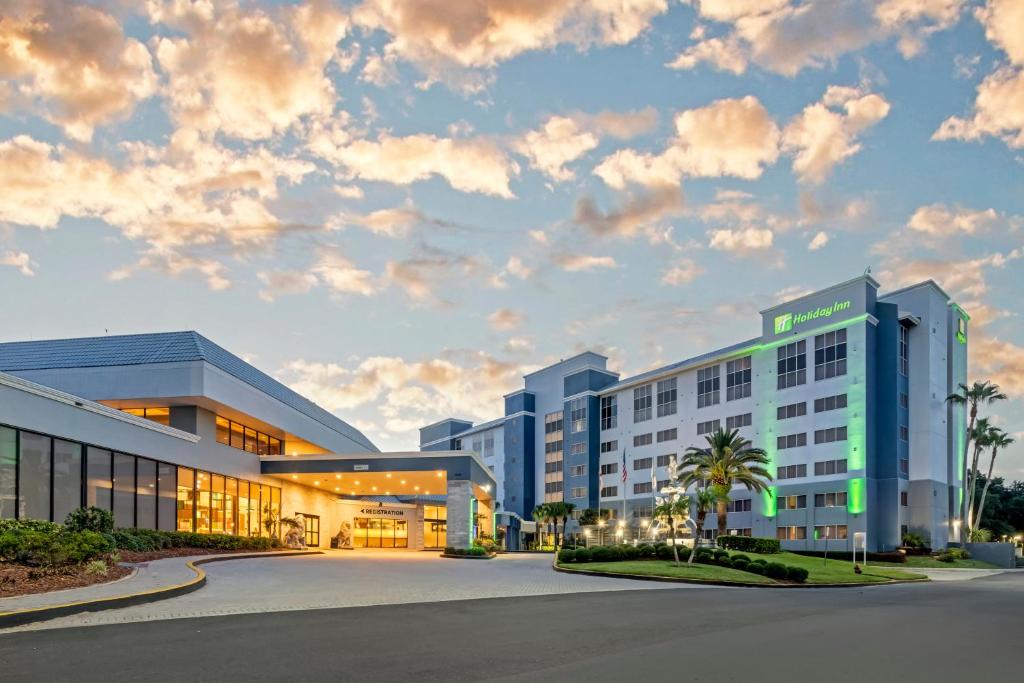 a rendering of a hotel with a cloudy sky at Holiday Inn Orlando International Dr-ICON by IHG in Orlando