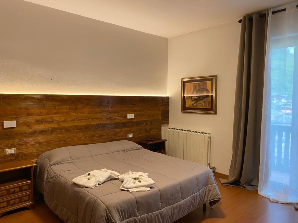 Postel nebo postele na pokoji v ubytování Albergo Quai