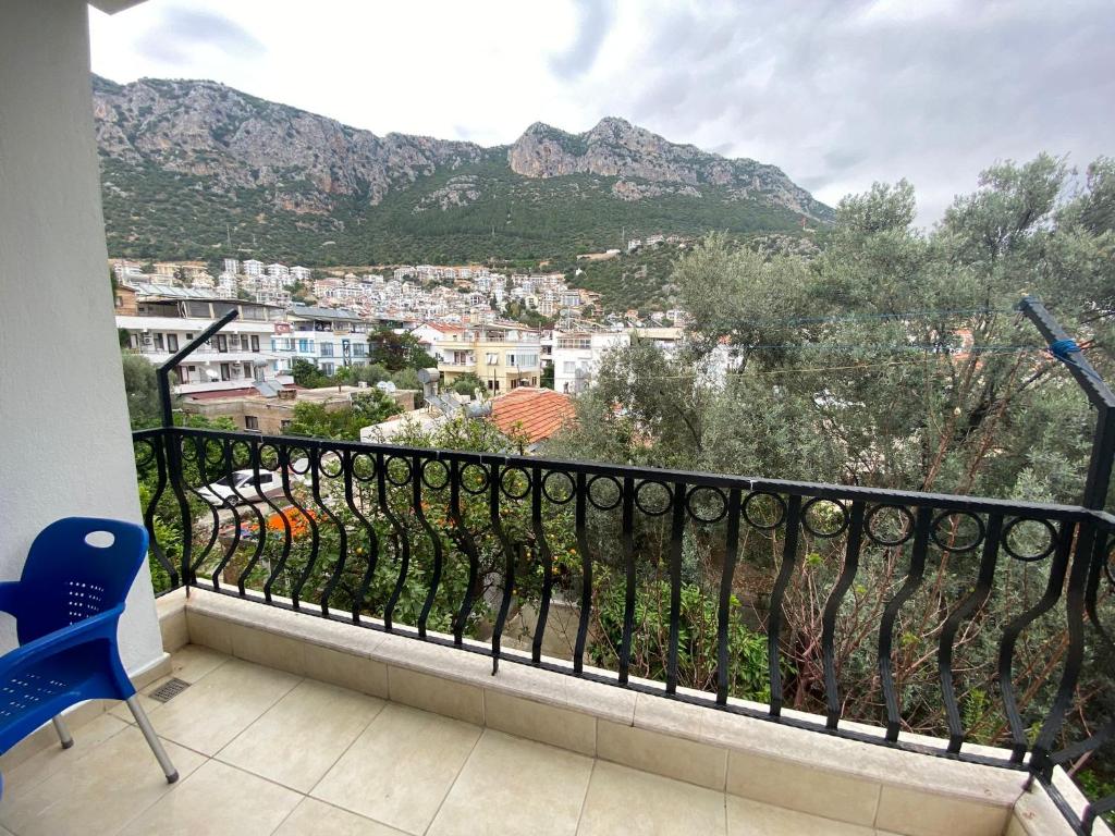 a balcony with a view of a city and mountains at KAŞ MERKEZ İMREN APART 1 in Kas