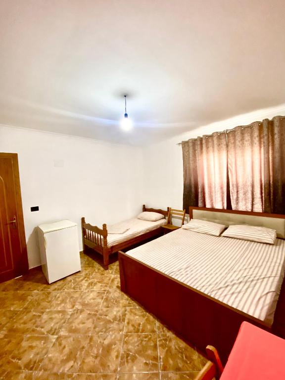 Postel nebo postele na pokoji v ubytování Villa Osmani