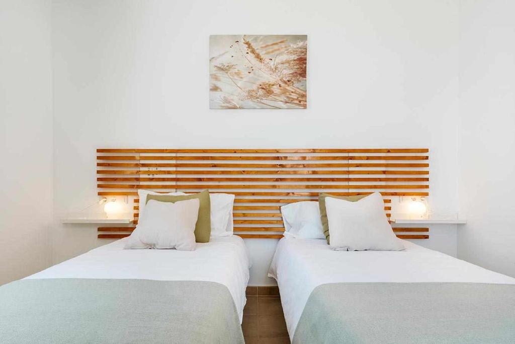 Postel nebo postele na pokoji v ubytování Villa Lyra Piscina Climatizada