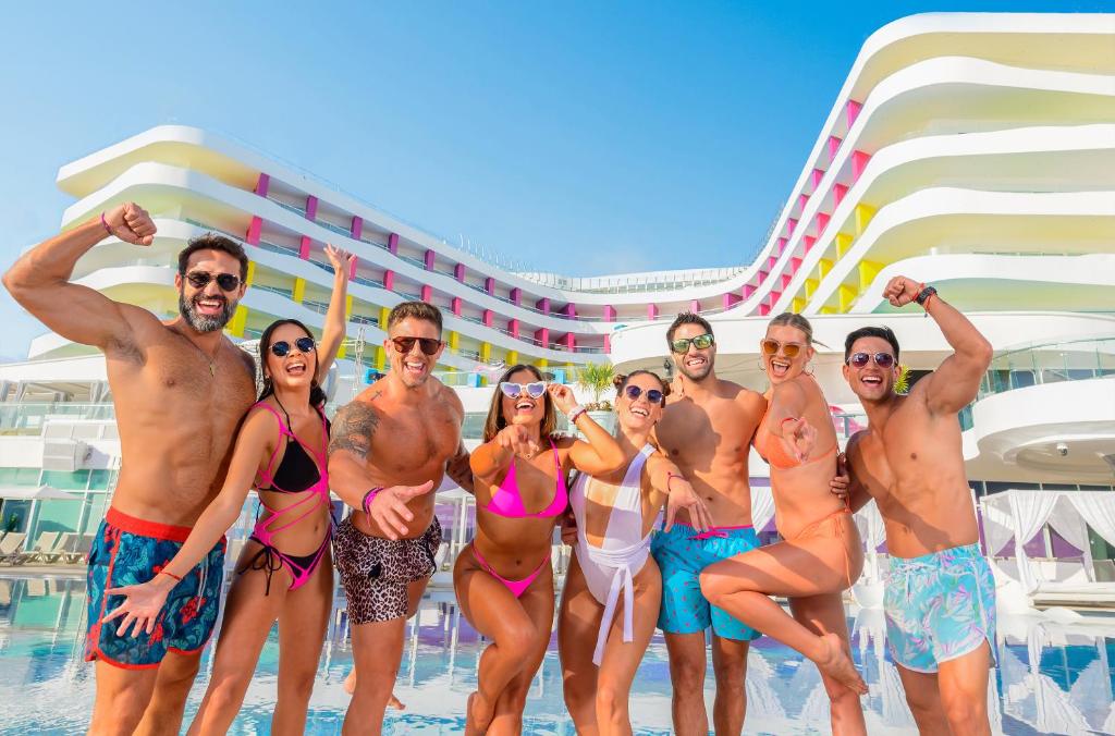 a group of people standing in the pool on a cruise ship at The Tower by Temptation Cancun Resort - All Inclusive - Adults Only in Cancún