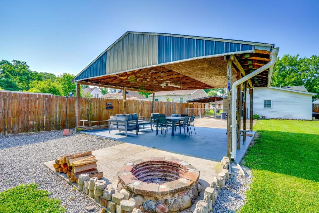 a patio with a fire pit in a backyard at Pet-Friendly Clarksville Home with Central AandC in Clarksville