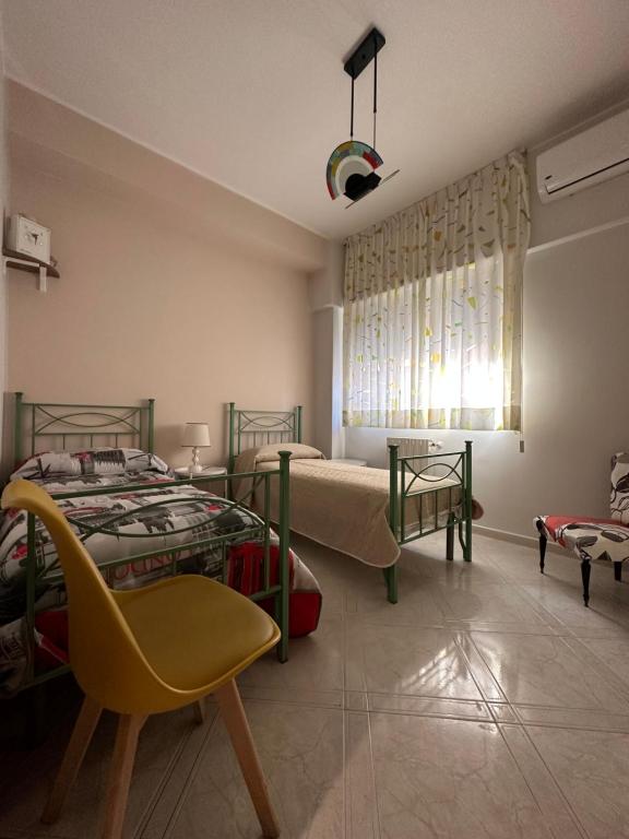 Posteľ alebo postele v izbe v ubytovaní Casa di Nonna Mariella