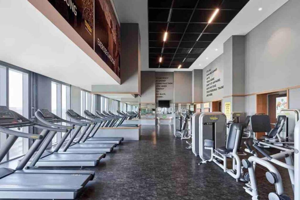 a gym with a row of treadms and machines at Skyland for luxury people 1+1 in Istanbul