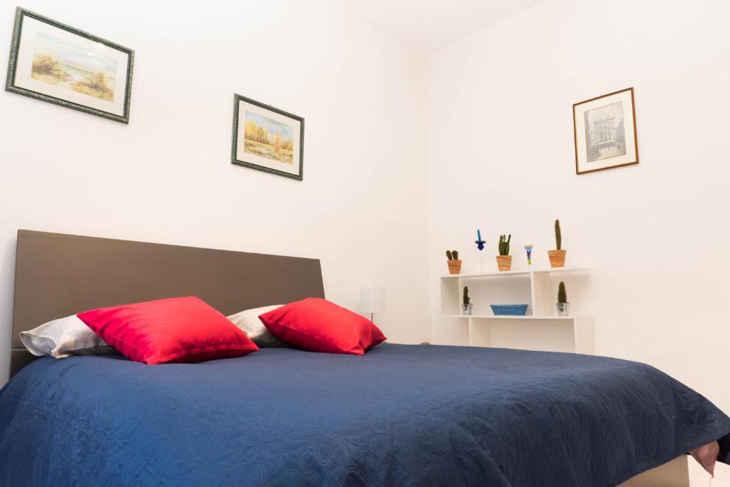 A bed or beds in a room at Casa Vacanze - Il Balconcino