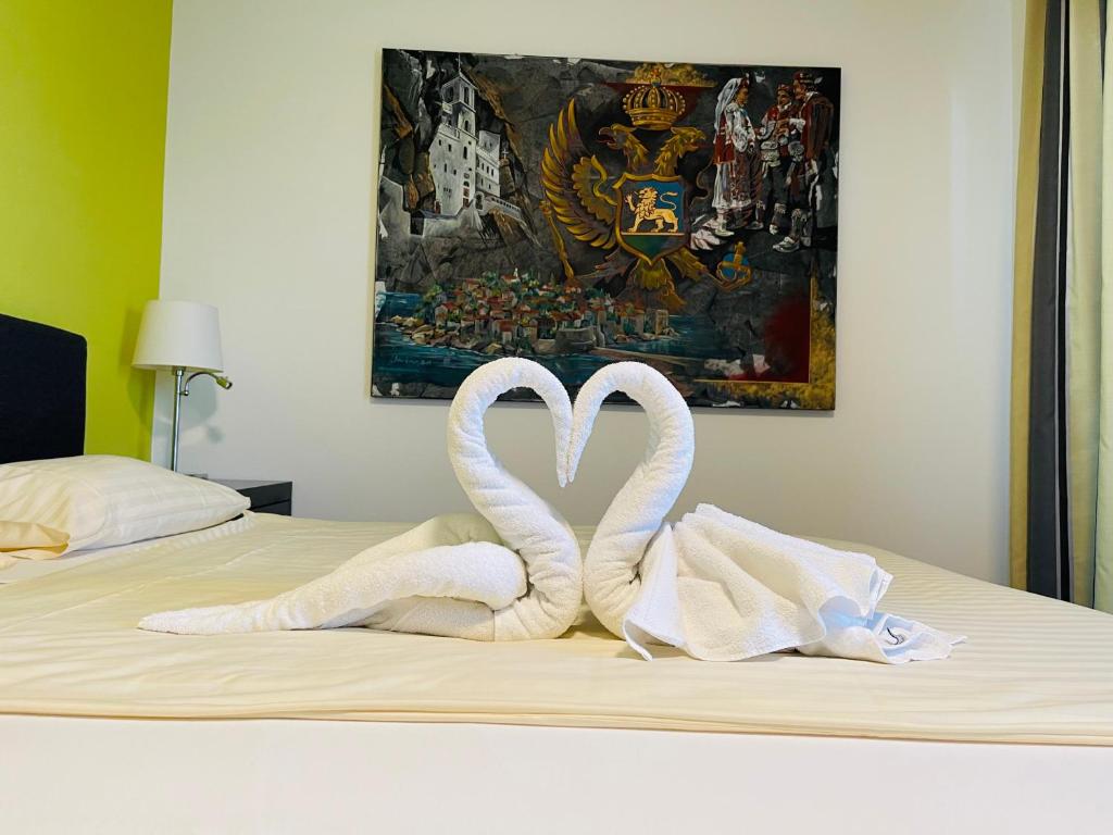 Uma cama ou camas num quarto em Hotel Swiss Bellevue