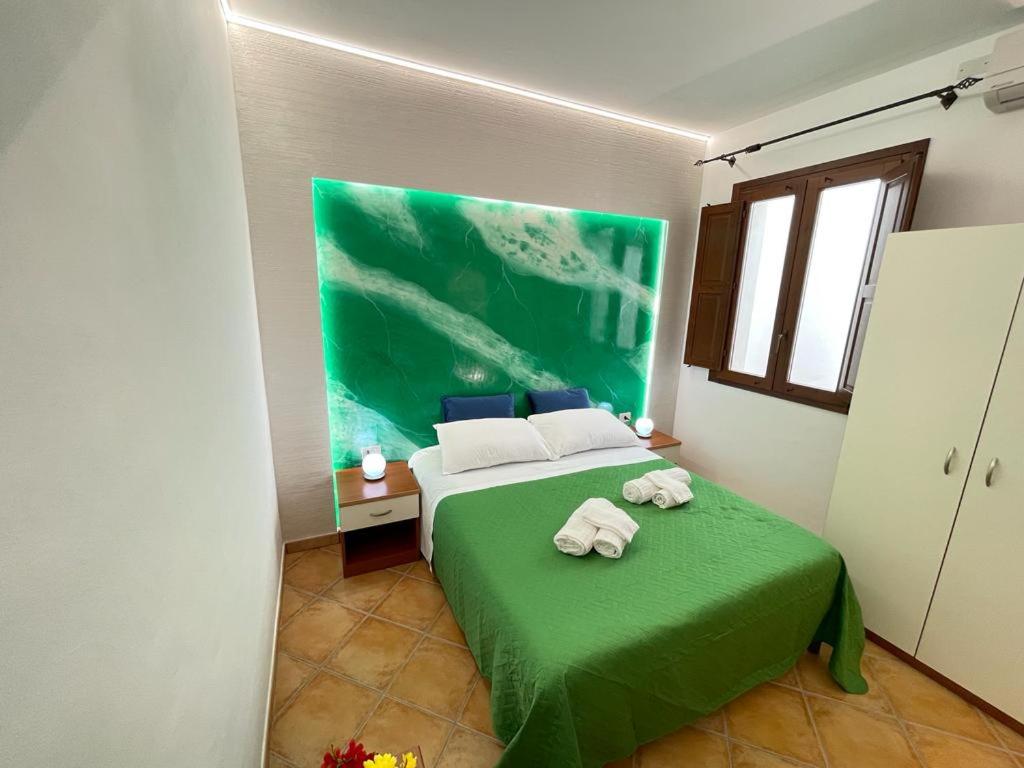 Postel nebo postele na pokoji v ubytování "L'Oasi di Favignana" Room and Charme