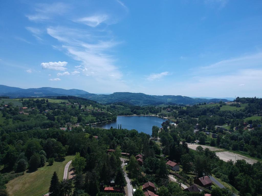 an aerial view of a lake in a valley at Charmant chalet en Auvergne proche du lac in Saint-Rémy-sur-Durolle