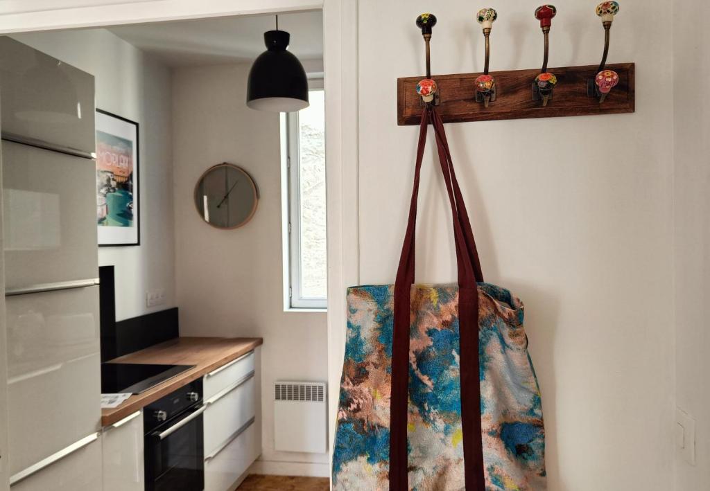 a kitchen with a bag hanging on the wall at Au Fil de soi in Morlaix