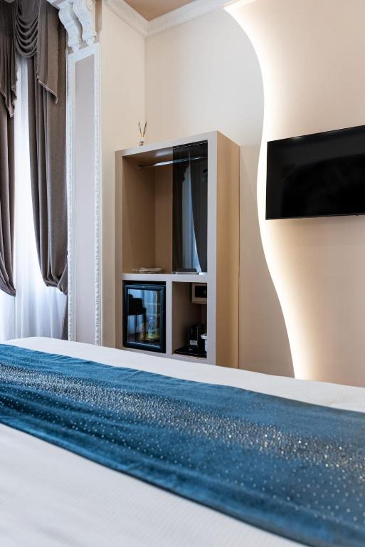 TV a/nebo společenská místnost v ubytování Queen Cattleya Suite