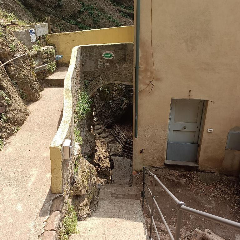 an entrance to a building with a tunnel and a stairway at Casa dell'Arco 31 in Camogli