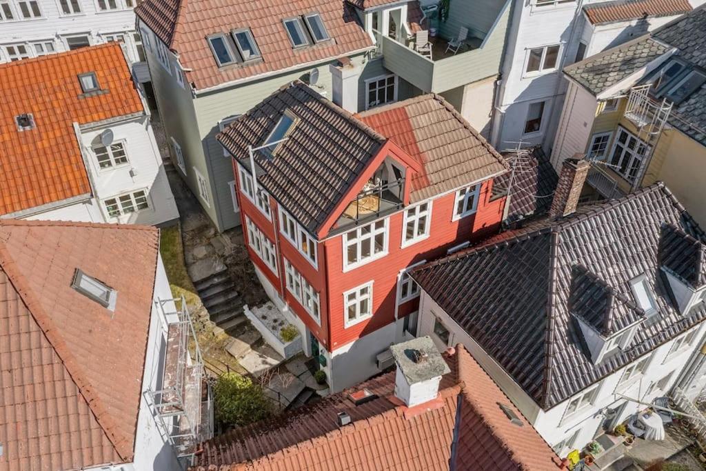 an overhead view of a group of buildings with roofs at Dinbnb Homes I 200m to Bryggen I Make Memories with Friends and Family! in Bergen