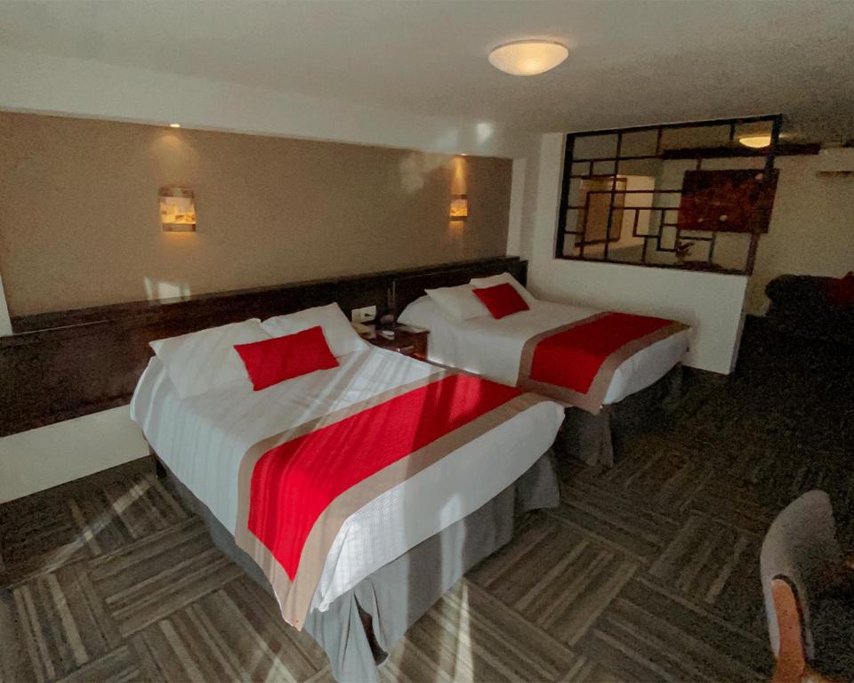 Postel nebo postele na pokoji v ubytování Ramada Plaza by Wyndham Leon