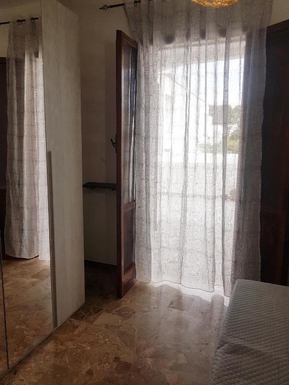 Postel nebo postele na pokoji v ubytování casa al mare kalispera