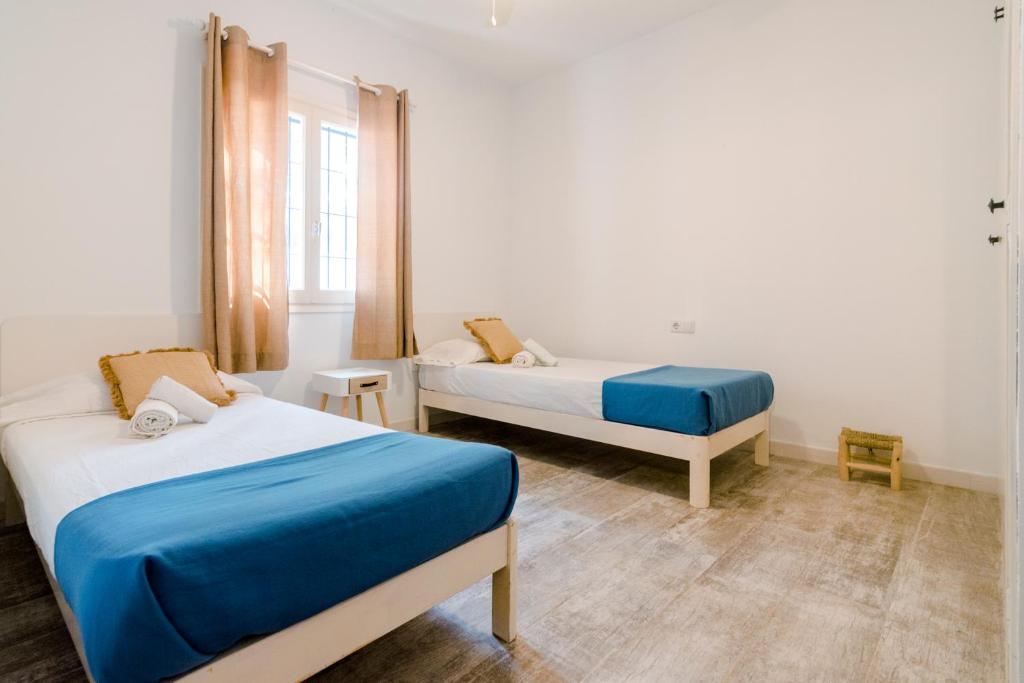 Postel nebo postele na pokoji v ubytování Apartamentos Verdera Es Pujols
