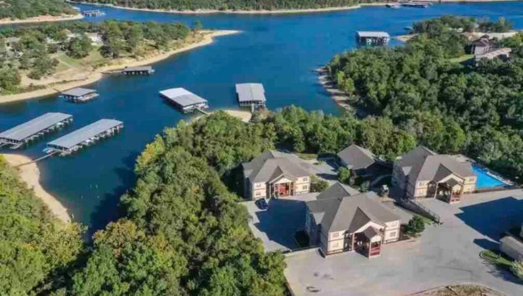 an aerial view of a house on a lake at Rockwood Condos on Table Rock Lake With Boat Slips in Branson