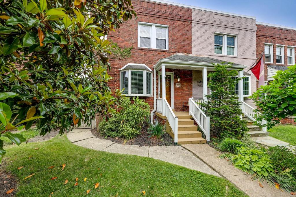 a brick house with a staircase in front of it at Modern Alexandria Townhome about 2 Mi to Old Town! in Alexandria
