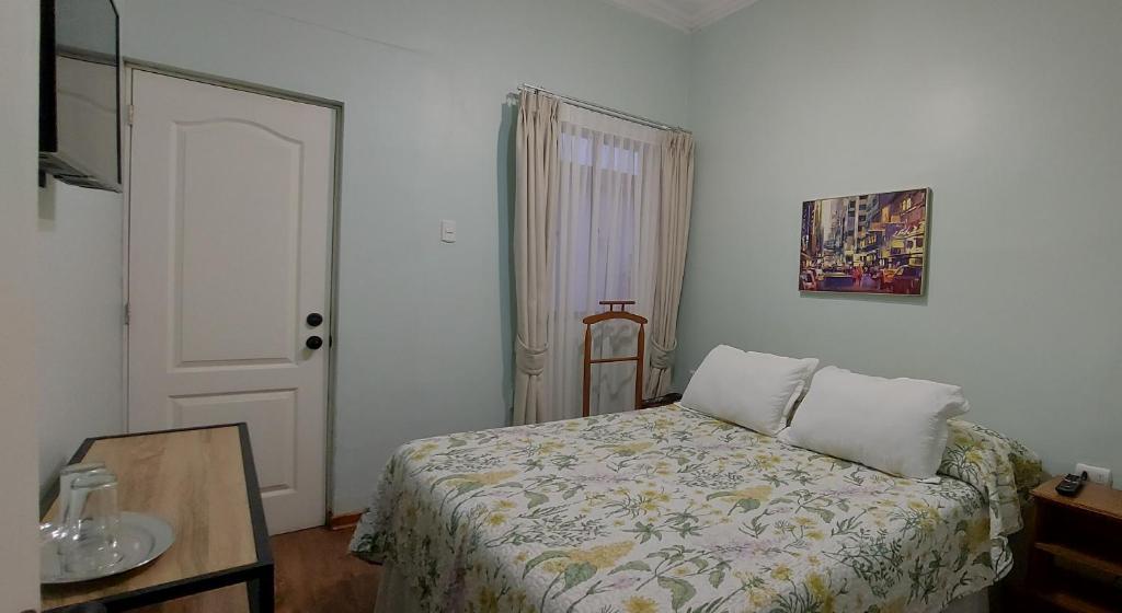 Postel nebo postele na pokoji v ubytování Hotel Chagual