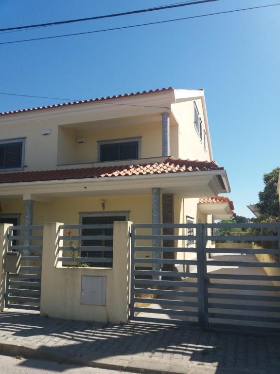 a house with stairs in front of it at Alojamento dos Redondos in Fernao Ferro