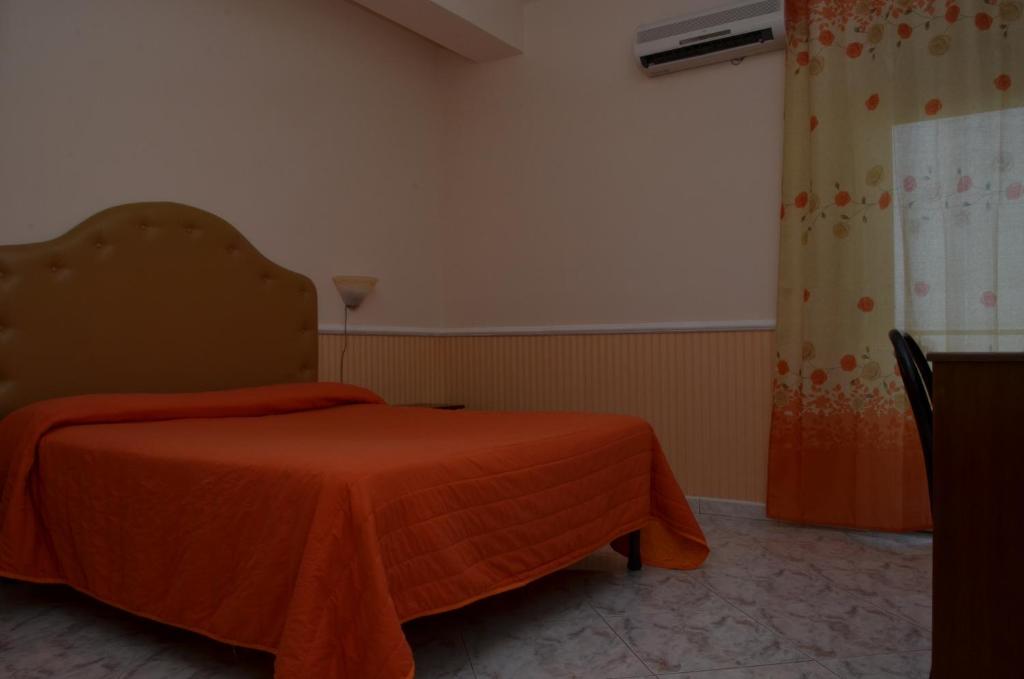 Postel nebo postele na pokoji v ubytování Hotel Stefany