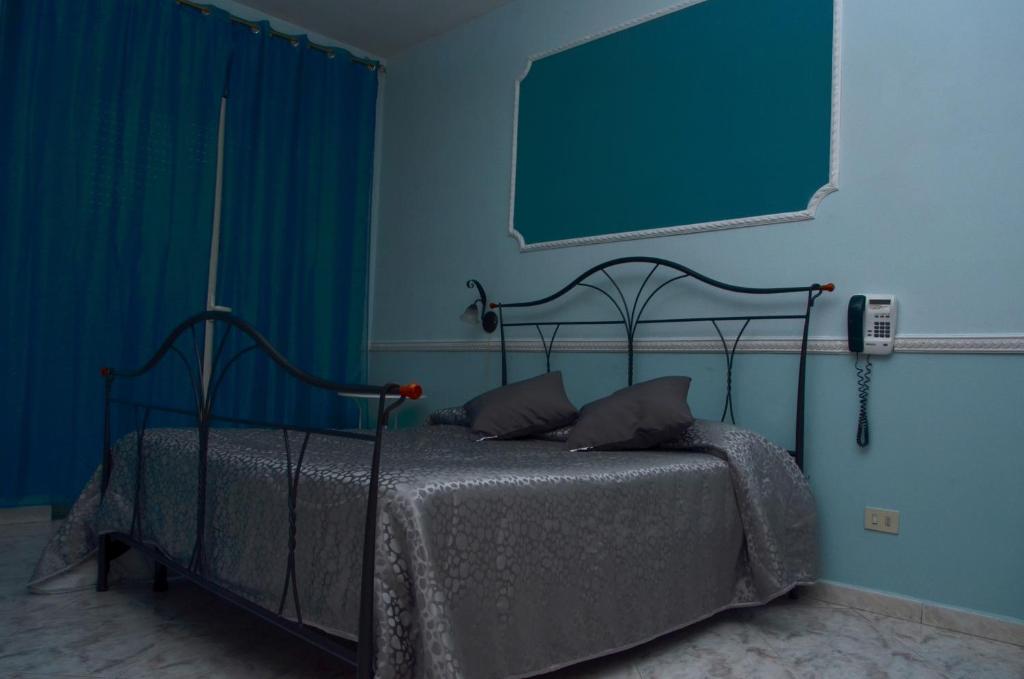 Postel nebo postele na pokoji v ubytování Hotel Stefany
