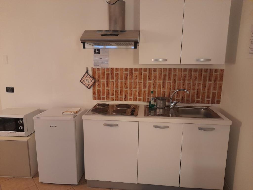 Kuchyň nebo kuchyňský kout v ubytování A Casa di Sole