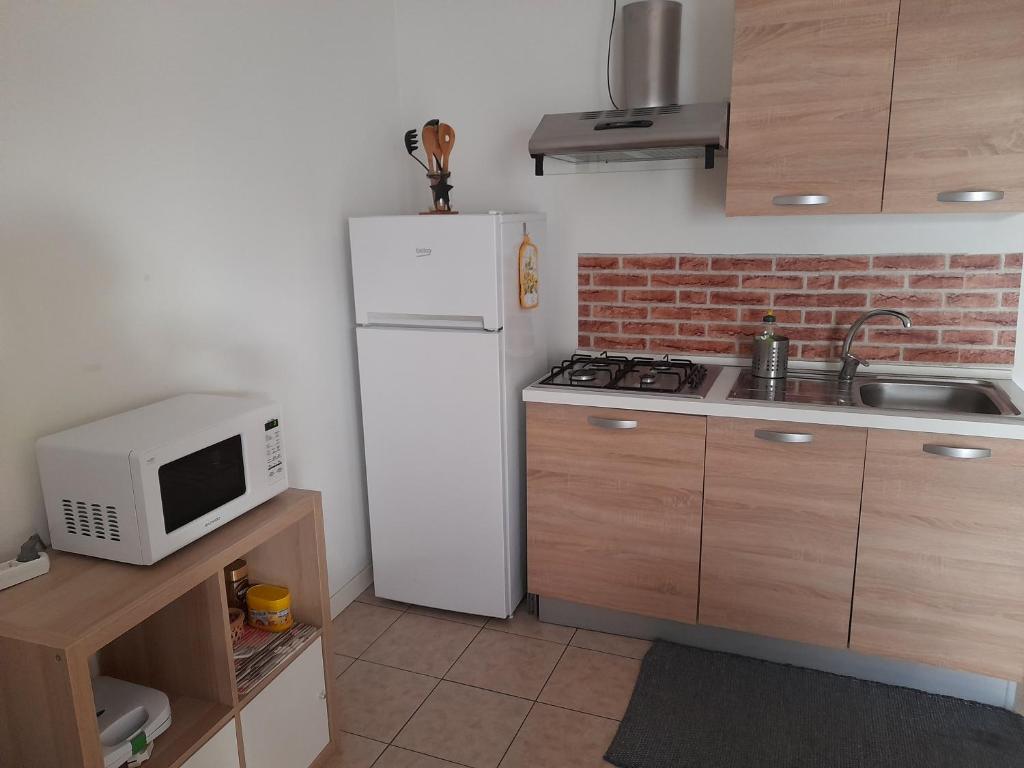 Kuchyň nebo kuchyňský kout v ubytování A Casa di Sole
