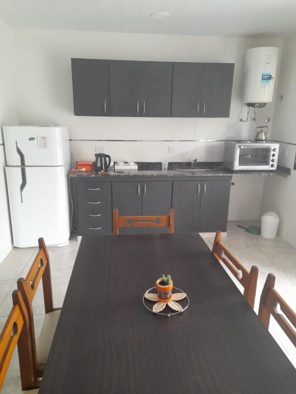 a kitchen with a table with a plate of food on it at Apartamento Sinde in Villaguay