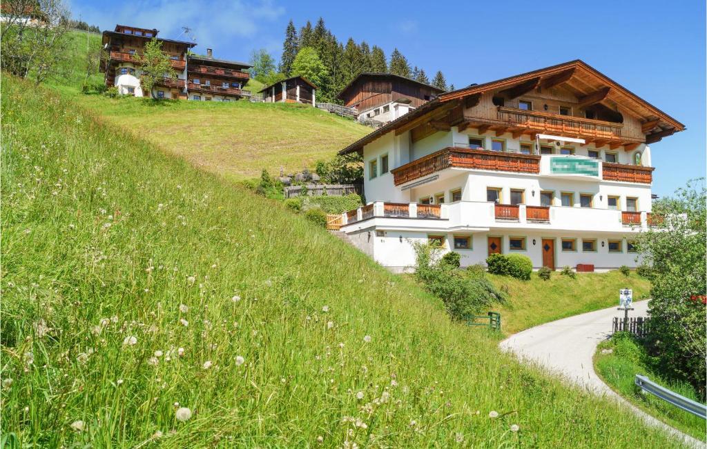 a building on the side of a grassy hill at Stunning Apartment In Aschau With Wifi in Aschau