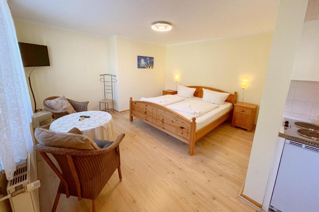 Postel nebo postele na pokoji v ubytování Bungalow Bergstrasse 3 Ferienwohnung 1