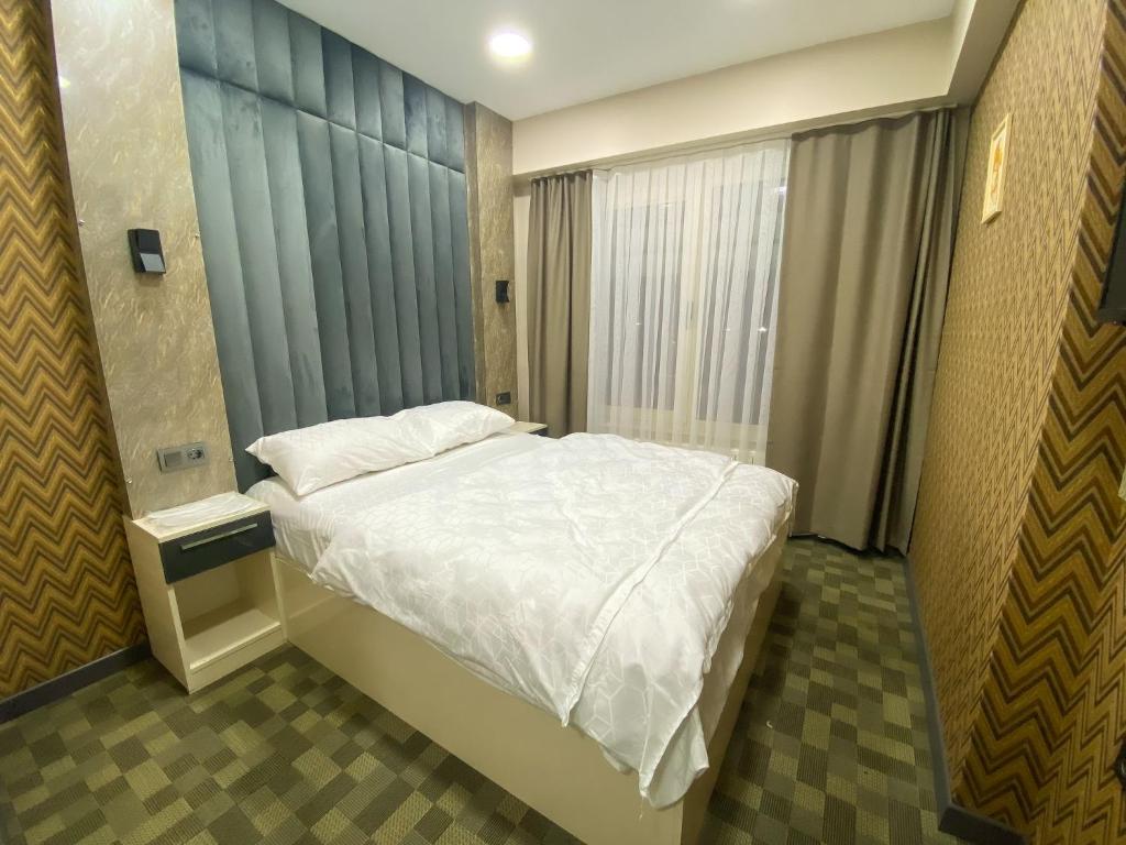 Postel nebo postele na pokoji v ubytování FLORYA EXPRESS OTEL