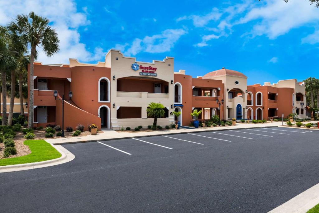 a street in front of a building at SureStay Plus Hotel by Best Western The Villages in Lady Lake
