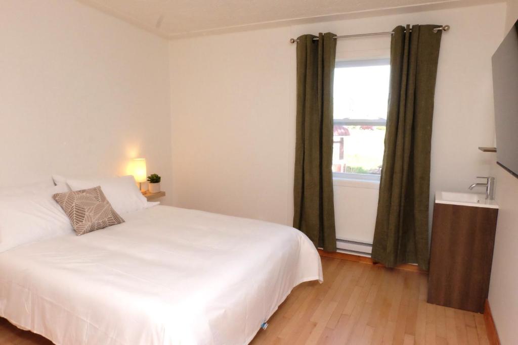 Llit o llits en una habitació de Auberge Mélilot