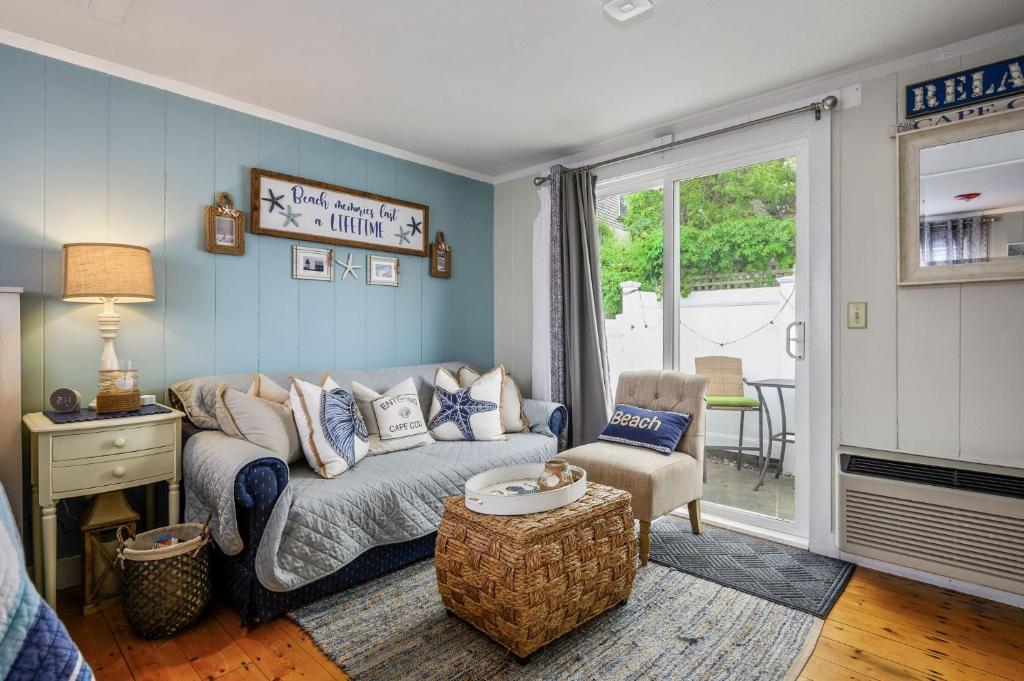 a living room with a couch and a chair at 200 Captain Chase Road Dennis Port Cape Cod - - Beach Retreat II in Dennis Port