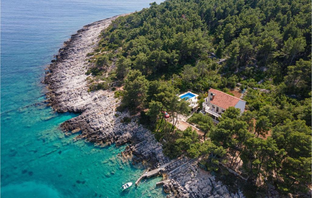 an aerial view of an island with a house and the ocean at Nice Home In Lumbarda With 8 Bedrooms, Internet And Outdoor Swimming Pool in Lumbarda