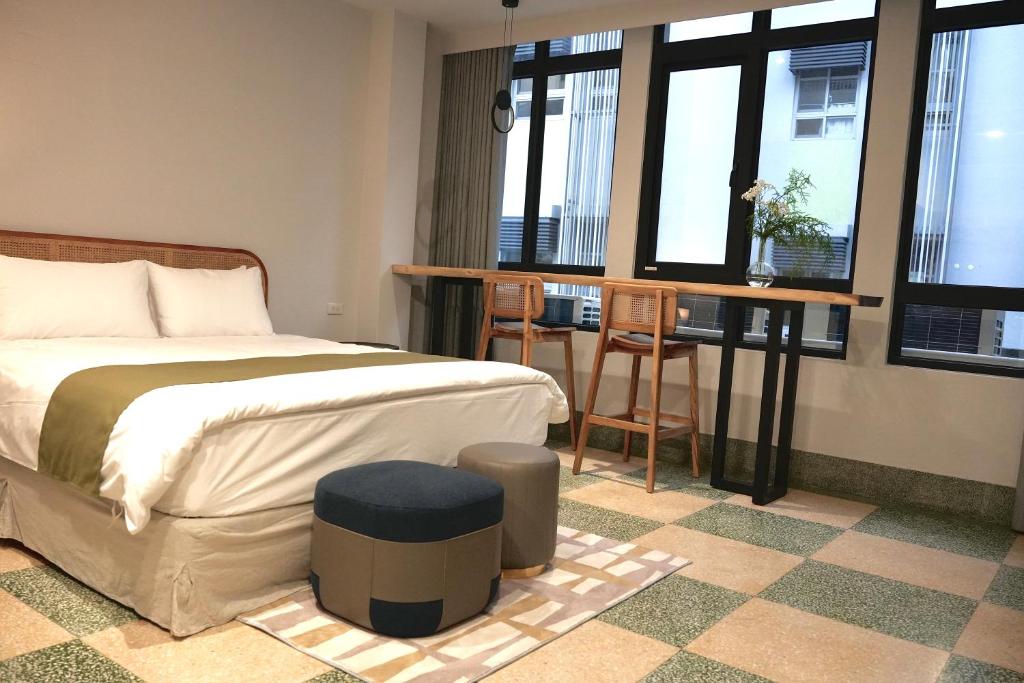 Postel nebo postele na pokoji v ubytování 璿 旅 Syuan Hotel