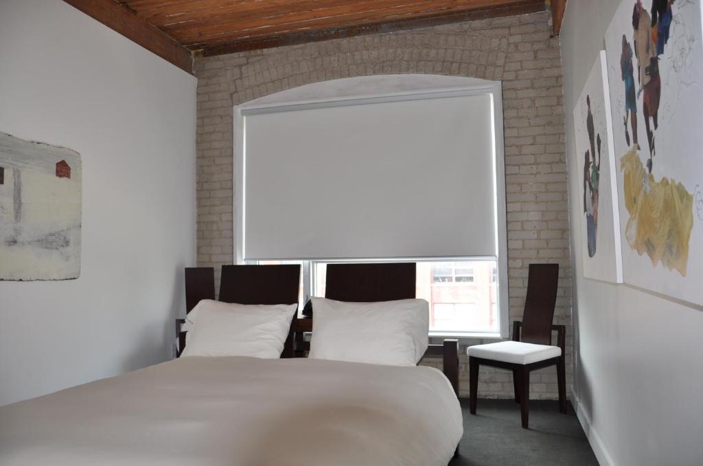 Postel nebo postele na pokoji v ubytování Hotel Ocho