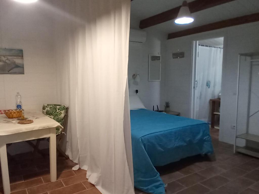 Łóżko lub łóżka w pokoju w obiekcie Domus Antiga Appartamenti