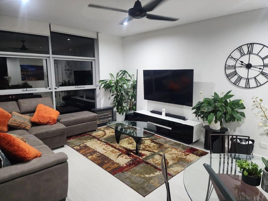 a living room with a couch and a flat screen tv at Bondi Junction Beauty in Sydney