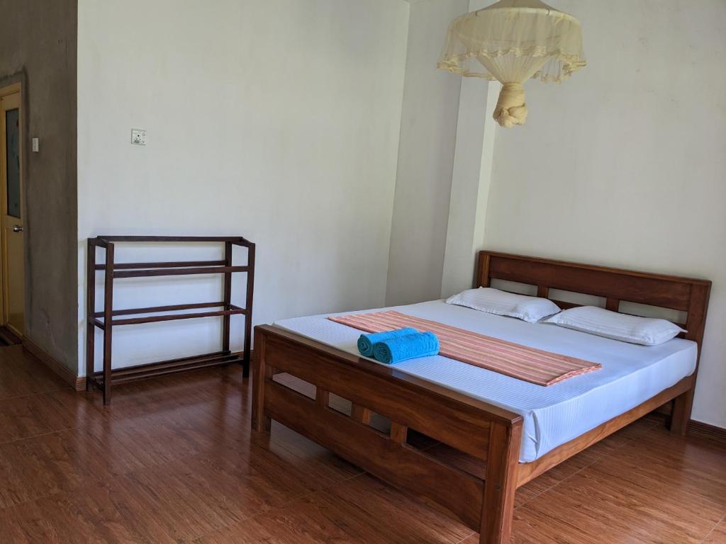 Postel nebo postele na pokoji v ubytování Afenta Motel- Mihintale