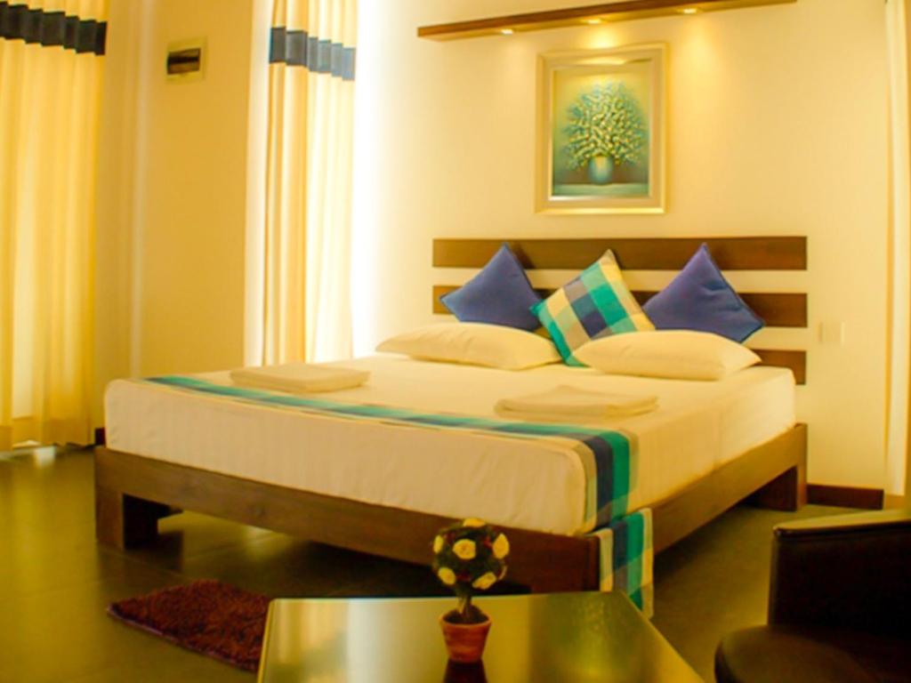 Postel nebo postele na pokoji v ubytování Hotel Alakamanda