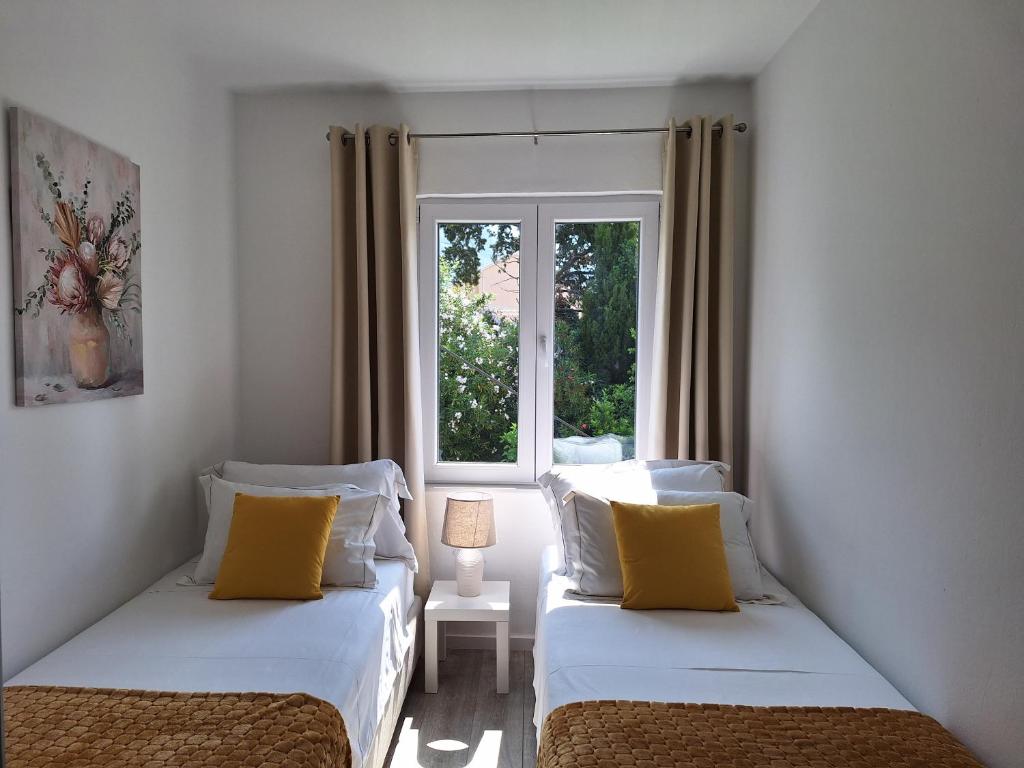 Posteľ alebo postele v izbe v ubytovaní Apartment Ivy