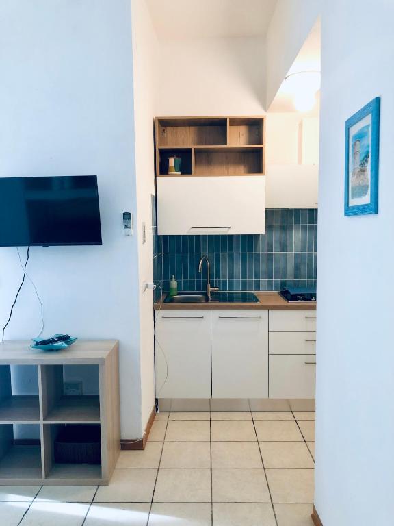 Kuchyň nebo kuchyňský kout v ubytování Appartamenti vicini al mare a Giglio campese